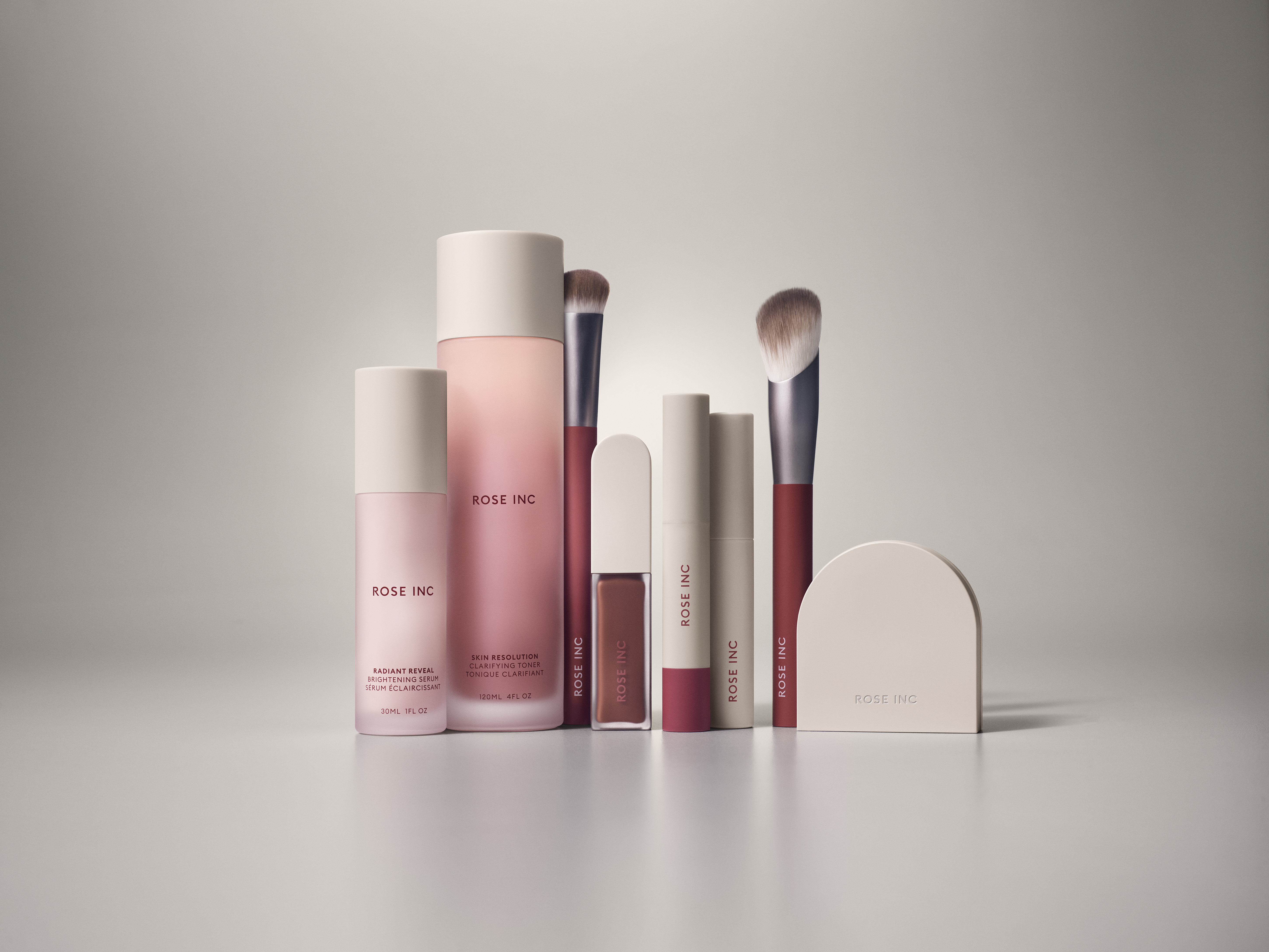 Lineup of Rose Inc beauty products.