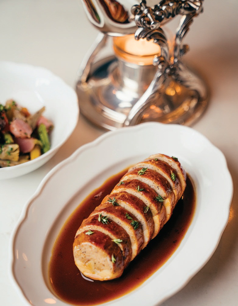 Refined mains like chicken with thyme and chicken jus exhibit their classic French training. PHOTO BY JOSH TELLES