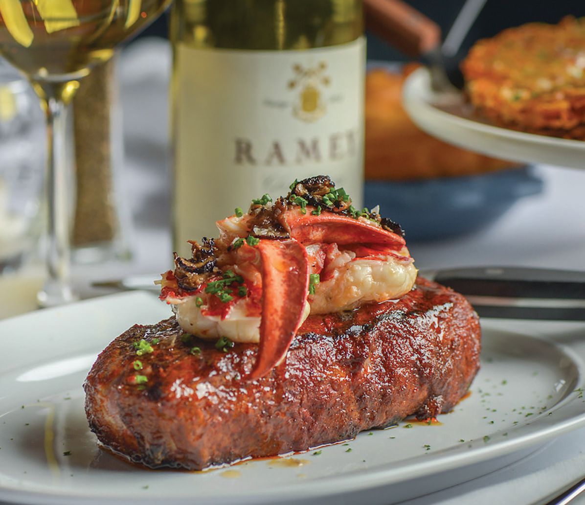 A New York strip with the black truffle sauteed Maine lobster enhancement. PHOTO COURTESY OF STEAK 48