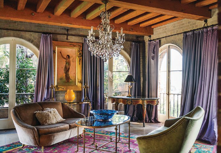 “The bold colors, opulent gilded mirrors, crystal chandeliers, allegorical artwork, chinoiserie, taxidermy and silk upholstered settees that [decorate] the mansion set a feeling of environmental submersion or time travel,” she says NEUE FOCUS PHOTOGRAPHY