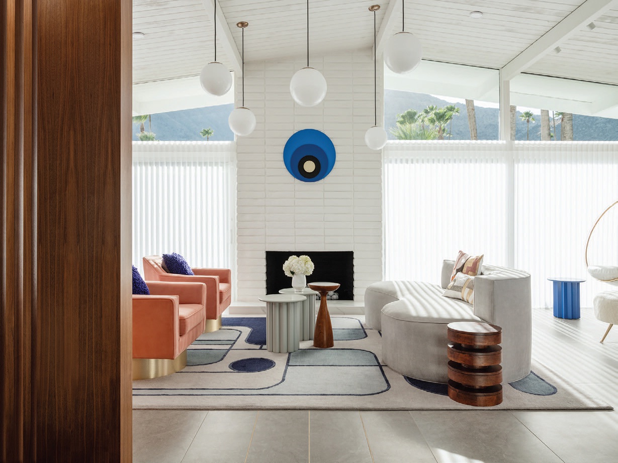 The living room buzzes with strategic doses of color, as seen in the custom furniture by Boudreau and a custom rug by Erik Lindstrom PHOTOGRAPHED BY LANCE GERBER