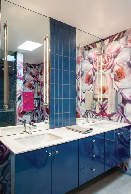 The primary bathroom is bursting with colorful pieces, like the high-gloss navy vanity by Eclipse Cabinetry PHOTOGRAPHED BY DAN CHAVKIN