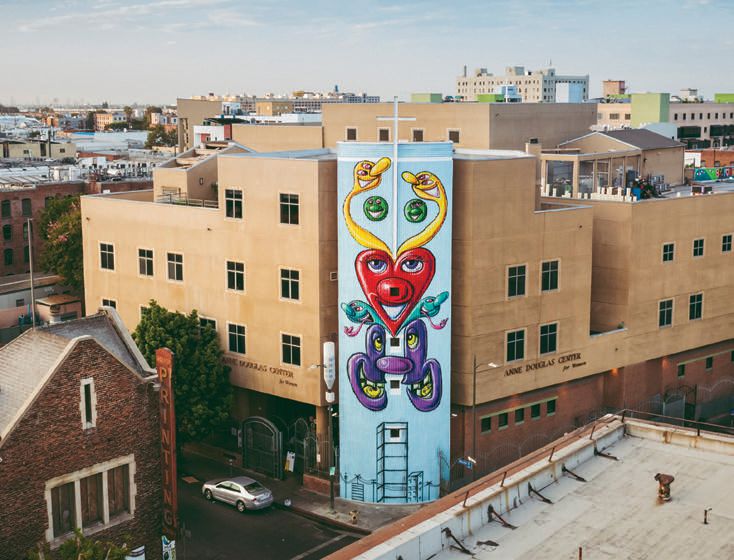 Artist and designer Kenny Scharf recently partnered with the Los Angeles Mission on a 66- foot mural in the city’s Skid Row neighborhood. It took Scharf four long days to complete the project, which can be viewed at the corner of Winston and Wall streets. PHOTO COURTESY OF LOS ANGELES MISSION