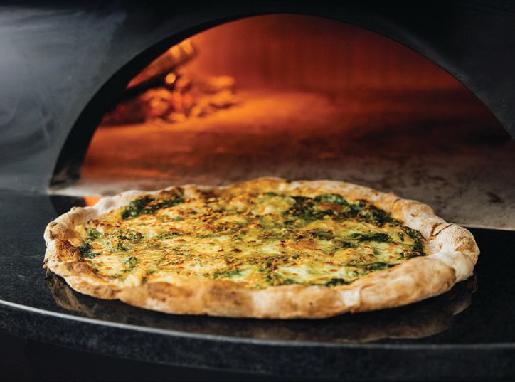 Pizzeria Bianco’s beloved green pizza with spinach-cream sauce PHOTO BY: ASHLEY RANDALL 