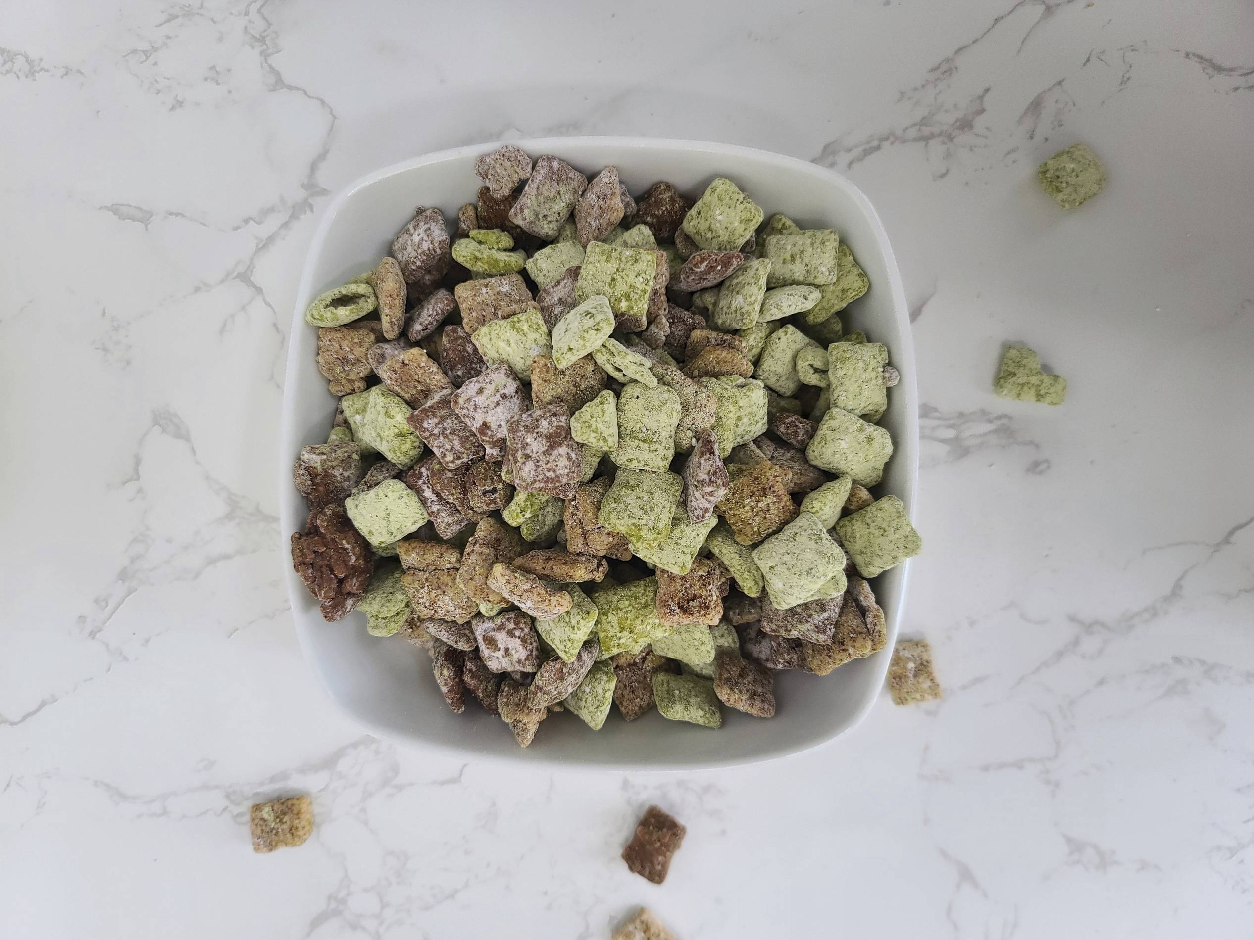 matcha puppy chow in a bowl